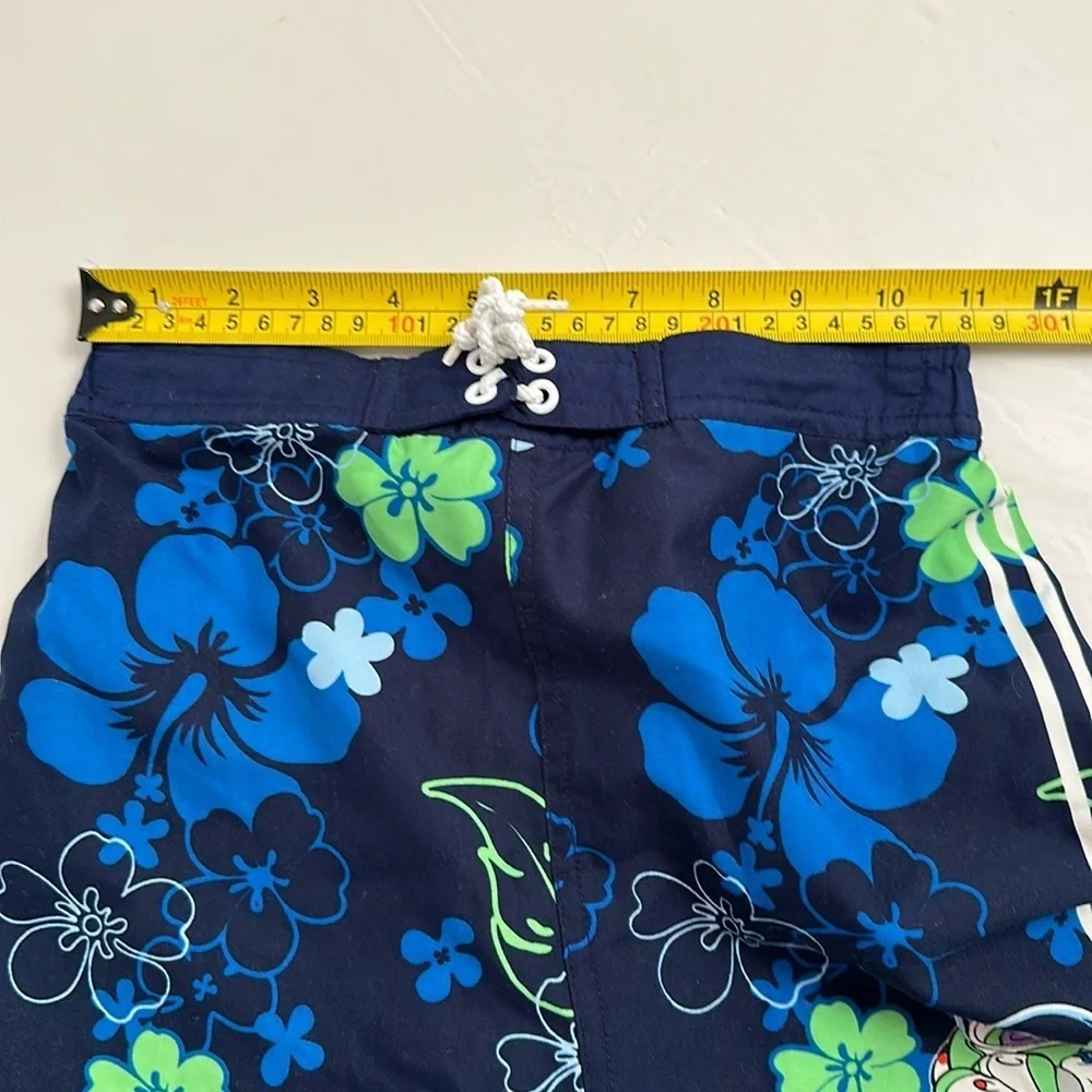 Disney blue green hibiscus print Buzz Lightyear mesh lined swim trunks M